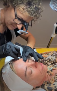 Superstar Professional technician doing the eyebrow tattooing to a client