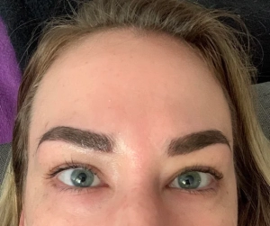 outcome of a client getting a combination eyebrow tattooing 